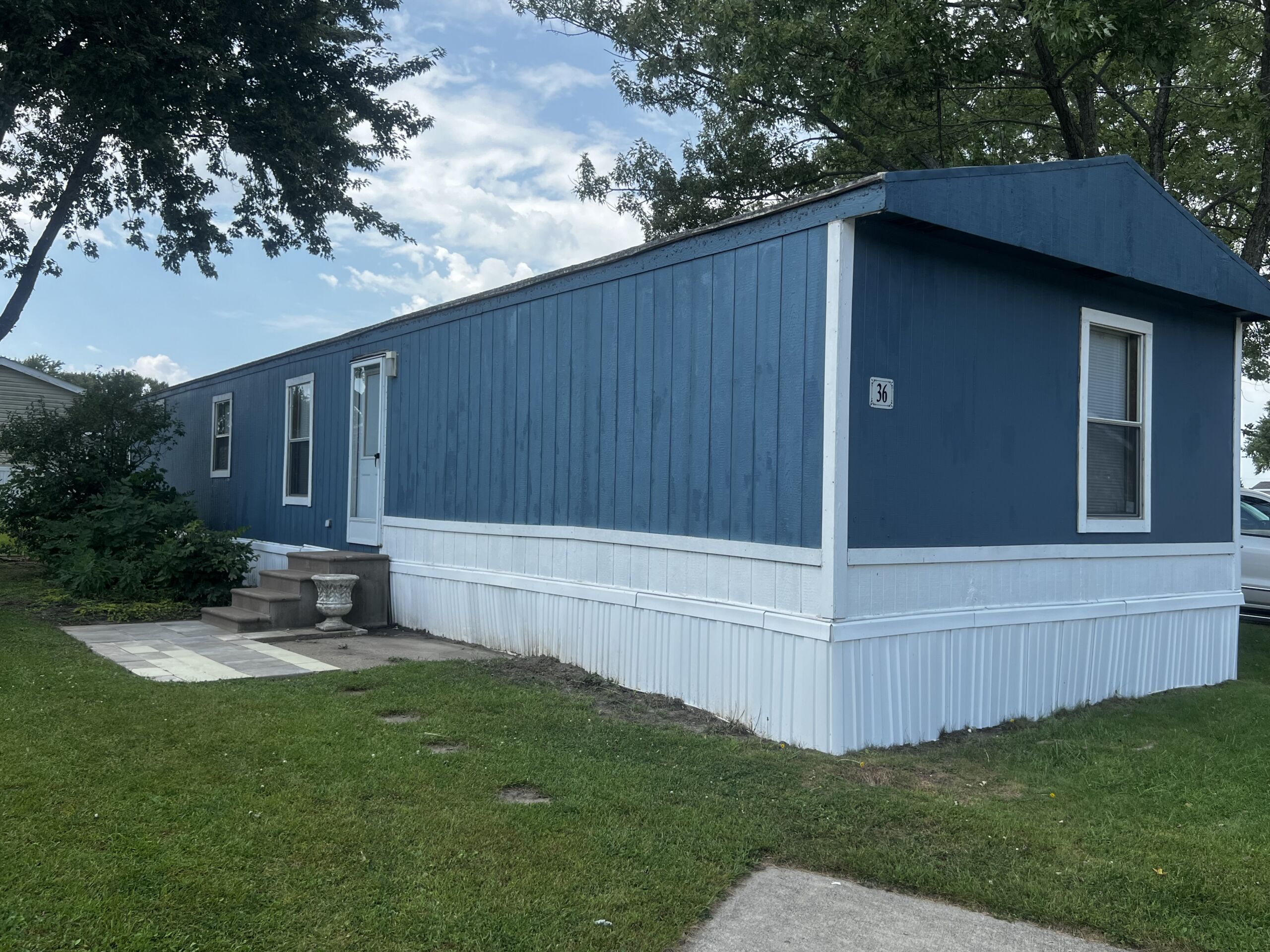 IMG_1392 Blue wood siding with white skirting